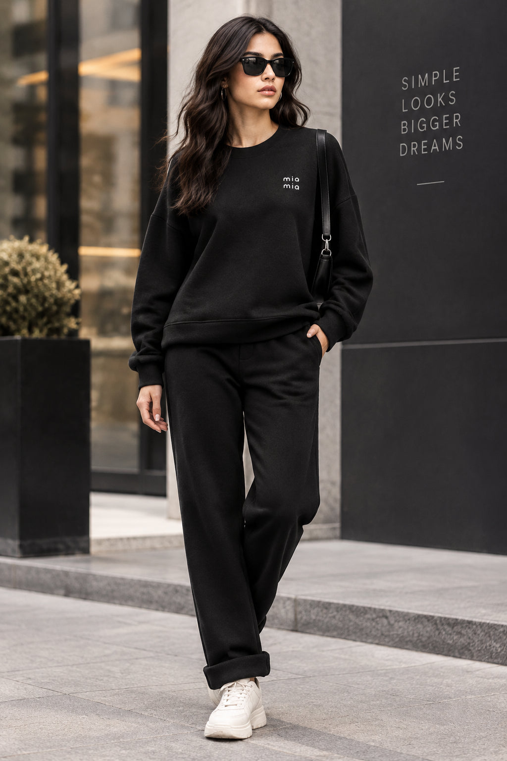 BLACK CO ORD TOP AND TROUSERS ITH SMALL DIEMONTE EMBLEM ON TOP 