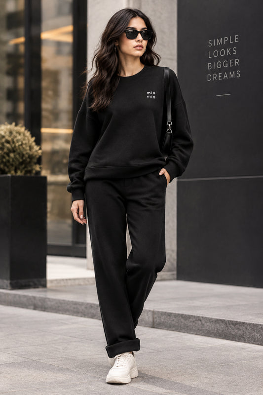 BLACK CO ORD TOP AND TROUSERS ITH SMALL DIEMONTE EMBLEM ON TOP 