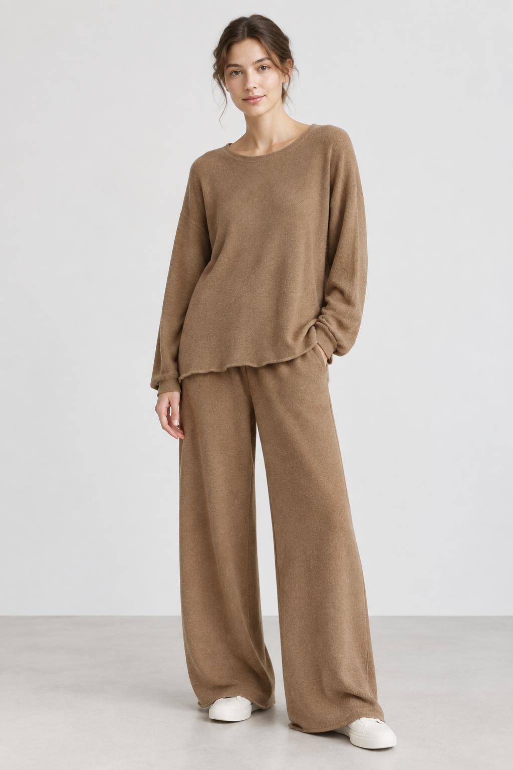 Female model wearing the beige knit set